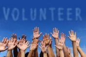 volunteer_group_raising_hands